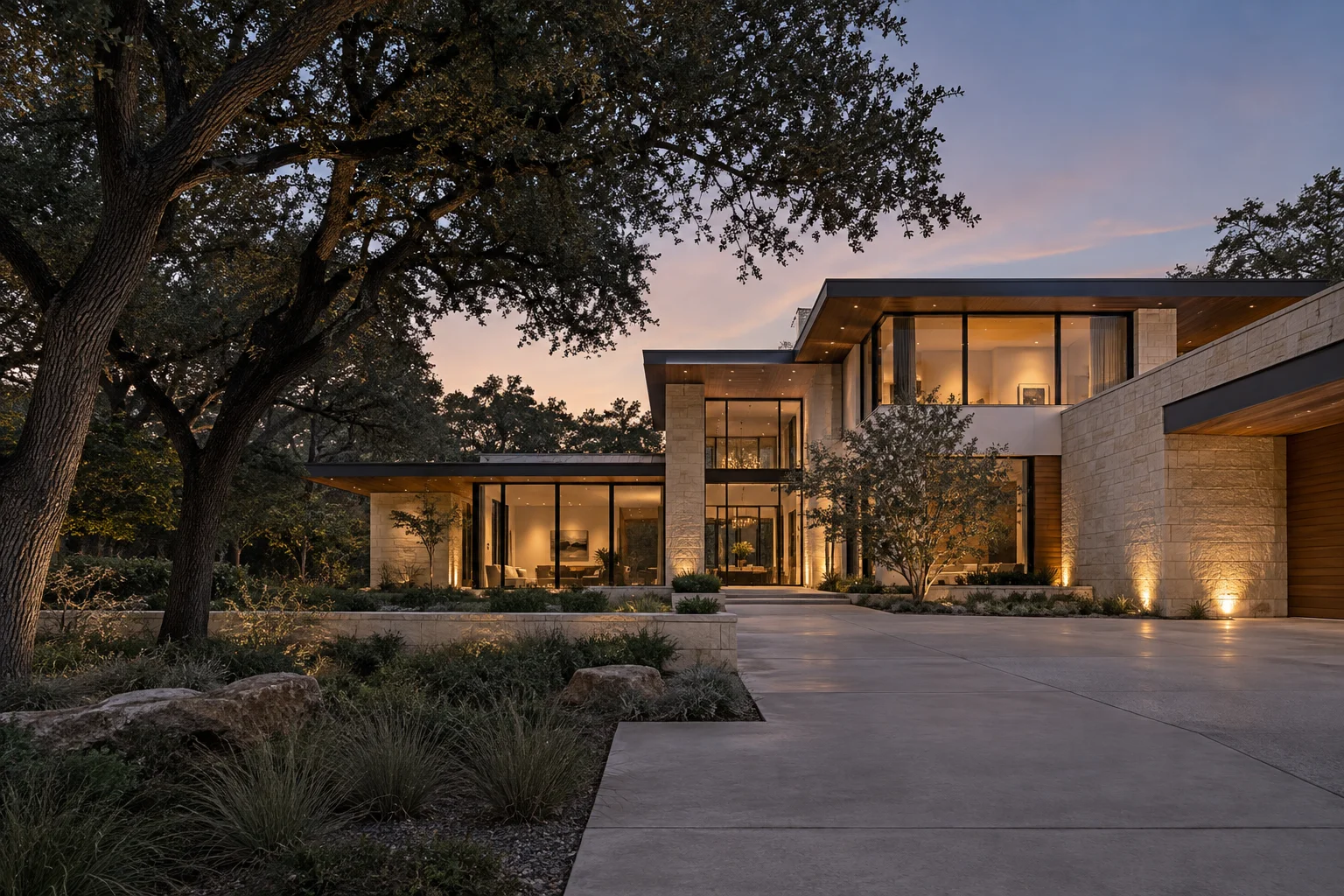 Illustrative contemporary home with limestone, broad glazing and warm evening light